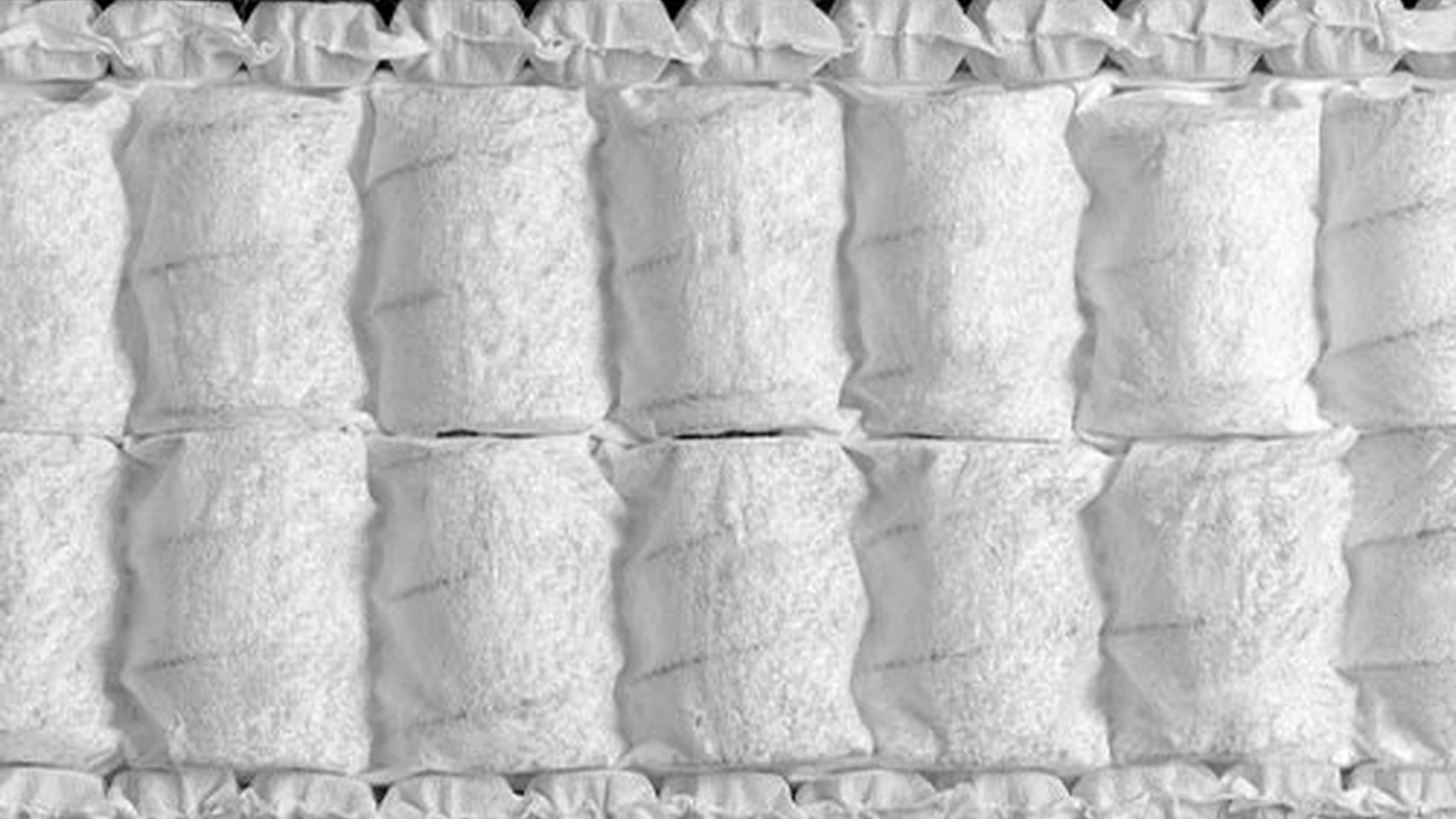 Materasso organico Leonardo composto da due strati di molle insacchettate e due di micromolle di Flou