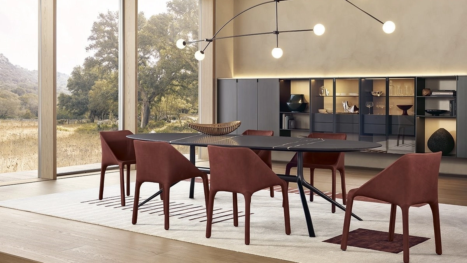 Tavolo ovale con piano in marmo e struttura in brown nickel opaco Mondrian di Poliform